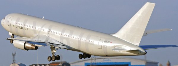 a Silverjet airline plane taking off